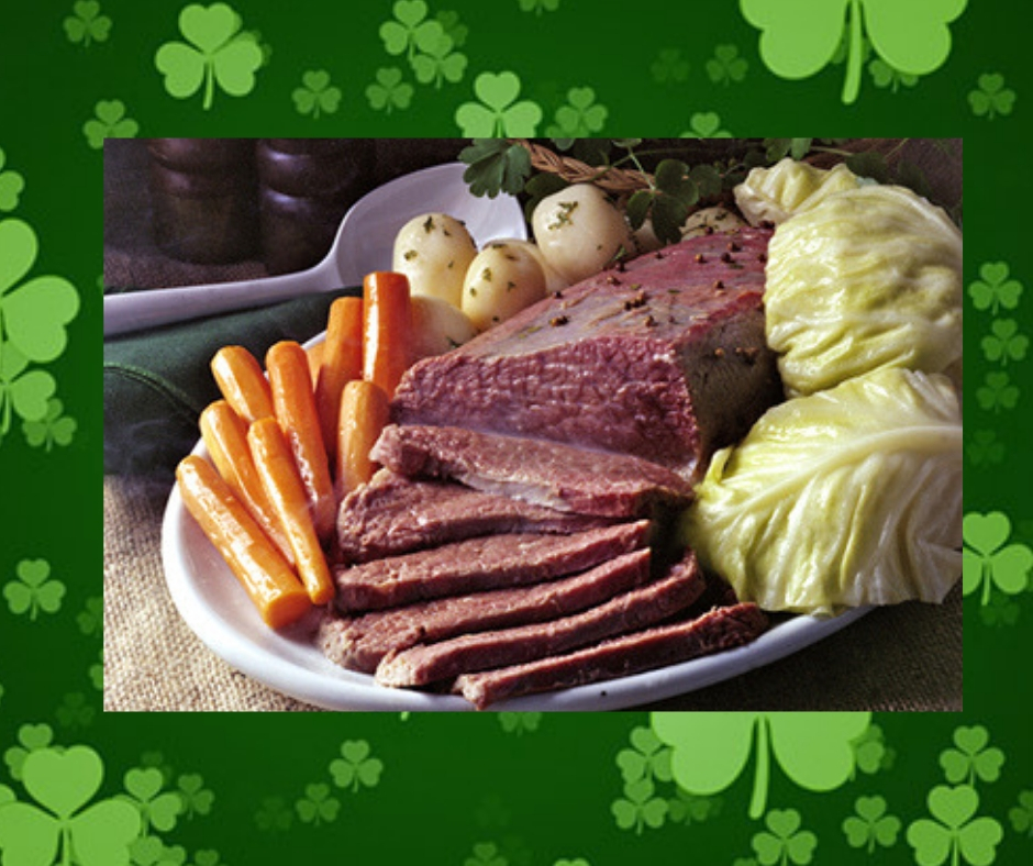 St. Patrick's Day background with a picture of corned beef and cabbage, potatoes and carrots
